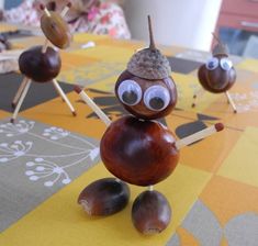 a table topped with figurines made to look like nuts and acorns