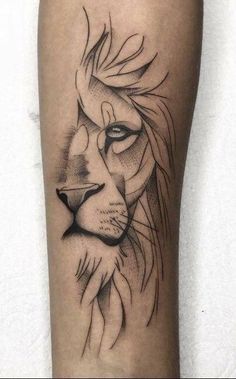 a black and white lion tattoo on the leg