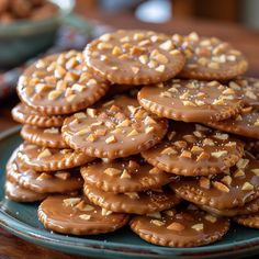 a plate full of cookies with nuts on top