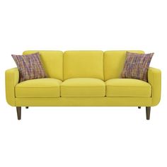 a yellow couch with two pillows on it's back and one arm facing the camera