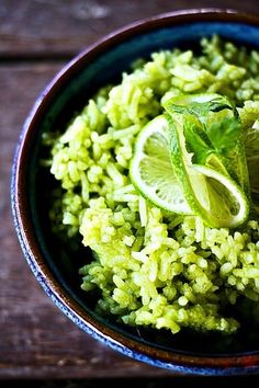 a bowl filled with rice and lime slices