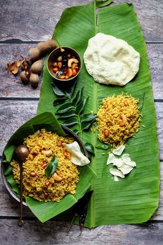 some food is sitting on a banana leaf and ready to be eaten by someone else