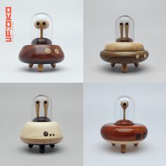 four different types of wooden toys with glass domes on them, including an animal shaped object