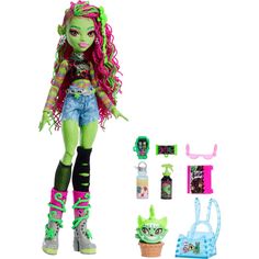 the monster doll has green hair and is next to it's accessories, including an ice cream cone