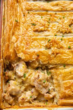 a casserole dish with meat and vegetables in it, ready to be eaten