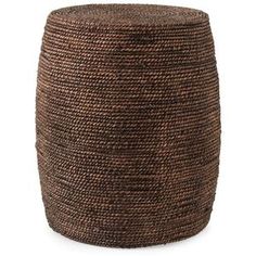 a large brown basket sitting on top of a white floor