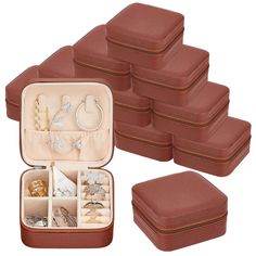 a set of six brown leather jewelry boxes filled with lots of different types of jewelry