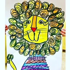 a child's drawing of a lion with spirals on his face and mane