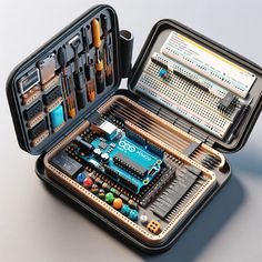 an open case with electronic components inside on a white surface, including pens and pencils