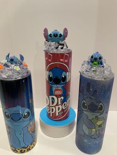 three different types of dr pepper cans on display