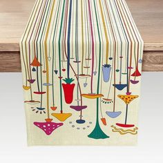 an image of a table runner with colorful designs on it