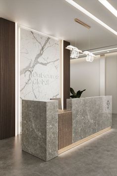 an office lobby with marble and wood accents