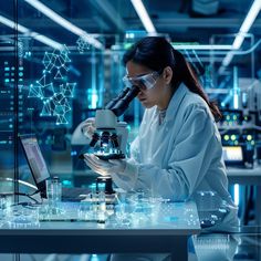 a woman in white lab coat and goggles looking through a microscope at something on a table