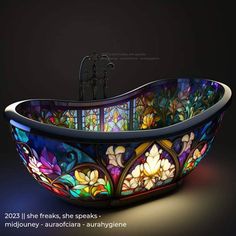 an ornate bathtub with stained glass in the center and flowers on the side, is shown