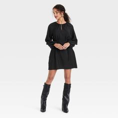 Get ready for any occasion in chic style with this Balloon Long-Sleeve Belted Mini Dress from A New Day™. Made from a midweight rayon-nylon blend for comfortable wear, the pullover dress is fashioned in solid shade with a mini-length silhouette. It features a shirred neckline with a keyhole-front accent, balloon long sleeves with raglan shoulders and a slim fabric belt for cinching your waist with a flattering fit. Simply pair it with your favorite footwear to complete the look. A New Day™: Styl Black Dress And Boots, Dress And Boots, Ballet Dress, Black Casual Dress, Mini Sweater Dress, Women Midi, Women Maxi, Fabric Belt, Black Xs