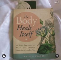 the body heals itself book sitting on a bed