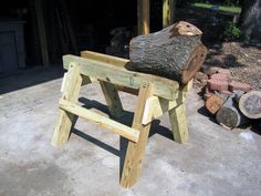 a bench made out of wood with a log sitting on it's back end