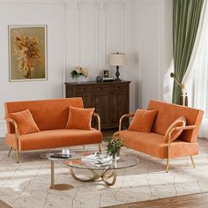 a living room with two orange couches and a coffee table