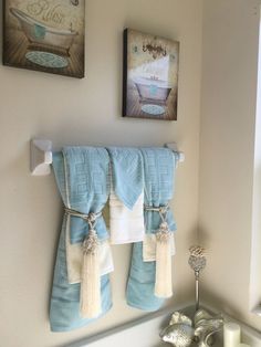 towels hanging on the wall in a bathroom