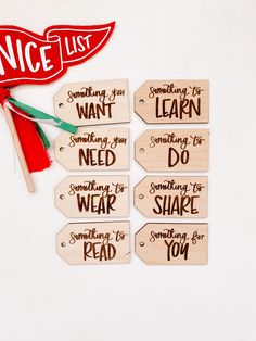 wooden tags with words on them that say something you want to do and someone else is reading