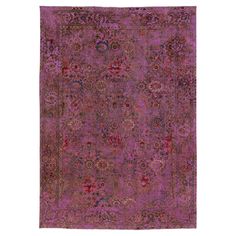 an antique rug with purple and red colors