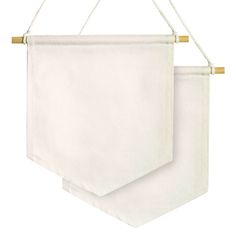 two white towels hanging from a rope on a white background with gold pins and wooden pegs