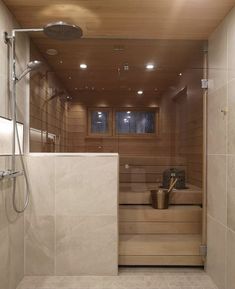 a very nice looking bathroom with some kind of shower head in it's wall