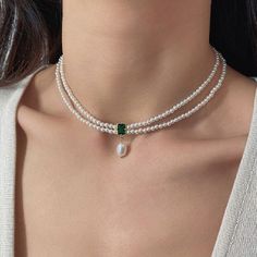 ✦ 𝐈𝐭𝐞𝐦 𝐃𝐞𝐬𝐜𝐫𝐢𝐩𝐭𝐢𝐨𝐧    Elevate your style with our exquisite Emerald Pendant Choker--a captivating blend of vintage charm and natural beauty. This stunning necklace features genuine emerald green stones and lustrous pearls, creating a timeless piece that exudes elegance. Perfect for a vintage-inspired look or a thoughtful Valentine's gift for her, this necklace effortlessly combines sophistication with a touch of romance. Adorn yourself or a loved one with this unique Natural Stone Luxury Green Pearl Drop Necklace, Luxury Temple Jewelry Beaded Necklace With Pearl Chain, Adjustable Vintage Pearl Necklace, Luxury Elegant Purple Pearl Necklace, Luxury Gold Classic Beaded Necklaces, Luxury Green Festive Choker, Emerald Green Necklace, Pearl Necklace Choker, Pearl Jewelry Design