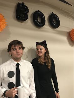 a man and woman are dressed up for halloween