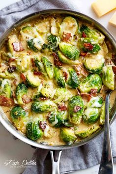 brussel sprouts with bacon and cheese in a skillet on a table