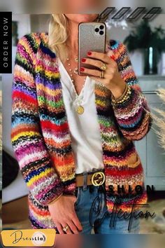 a woman is taking a selfie with her cell phone while wearing a colorful cardigan