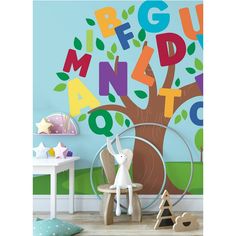 a child's room with colorful wall decals and toys