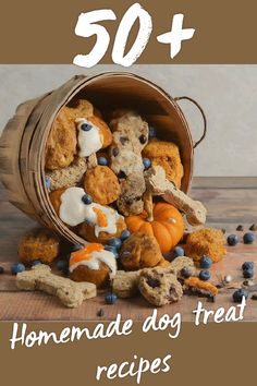 a bucket full of dog treats with the words 50 homemade dog treat recipes on it