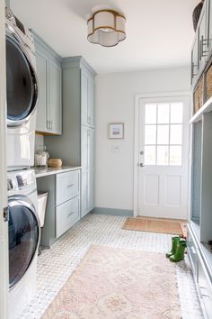 a washer and dryer in a small room