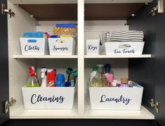 two white bins filled with cleaning supplies on top of a shelf next to each other