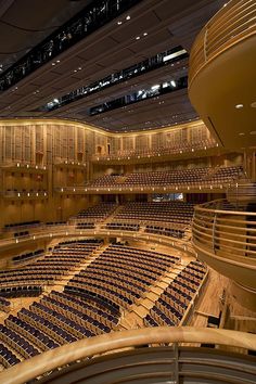 an empty auditorium with rows of seats and lights on the ceiling is seen from above