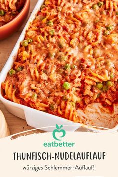 a casserole dish filled with pasta and vegetables on a wooden table next to two bowls