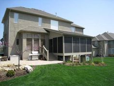 a house that has some grass in front of it