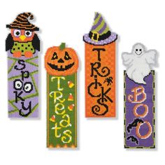 three cross stitch bookmarks decorated with halloween decorations and words on them, one has an owl, the other has a ghost