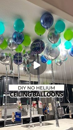 balloons are hanging from the ceiling in a kitchen