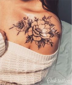 a woman with a flower tattoo on her shoulder