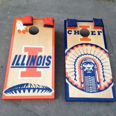 two cornhole game boards sitting on the ground