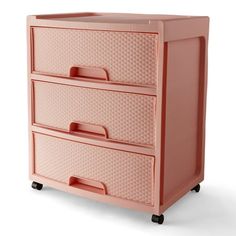 a pink dresser sitting on top of a white floor