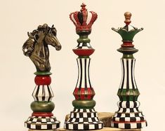 a chess set with two horses on the top and one horse on the bottom, sitting next to each other