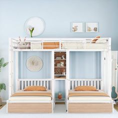 two bunk beds sitting next to each other on top of a white carpeted floor