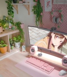 a computer screen with an anime character on it's display in front of a keyboard and mouse