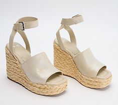 Whoa, Nelly! Fast track your footwear collection for summer savvy style with these espadrille wedges that are ready and willing to elevate your warm-weather wardrobe. From Marc Fisher LTD. Spring Platform Espadrilles In Synthetic, Synthetic Espadrilles For Spring Day Out, Spring Day Out Synthetic Espadrilles, Trendy Platform Espadrilles For Spring, Trendy Spring Espadrilles With Wedge Heel, Spring Wedge Sandals With Round Toe For Day Out, Round Toe Wedge Sandals For Day Out In Spring, Spring Wedge Sandals For Day Out With Round Toe, Espadrille Wedge Sandals For Spring