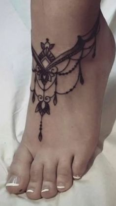 a woman's foot with a tattoo on it