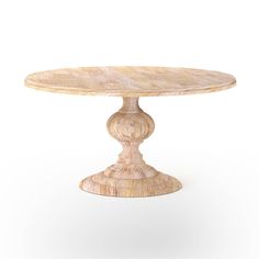 a round wooden table sitting on top of a white floor