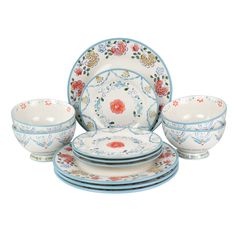 a set of dinnerware with flowers on it